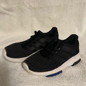 Adidas boys 12k black shoe with white bottom.